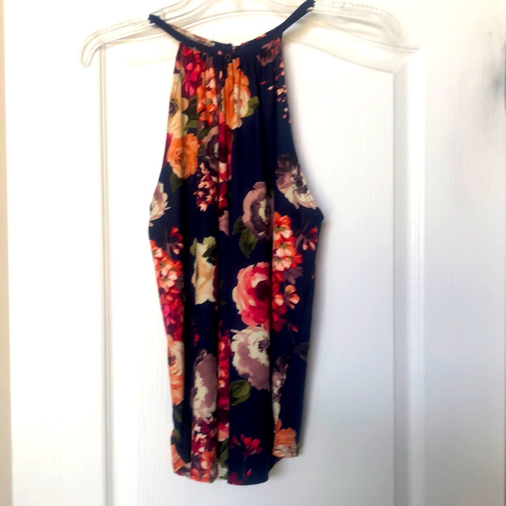 Halter style navy floral blouse.  Medium size, very flattering. Brand new.